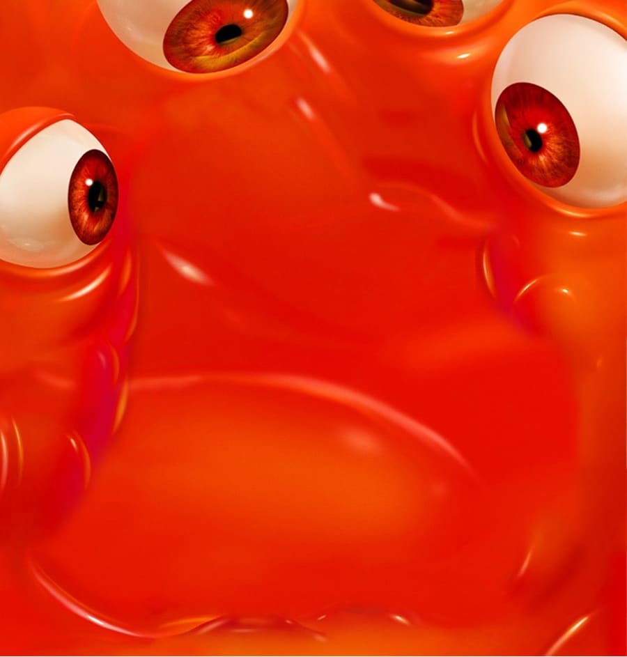 A bright orange scene plate covered in cartoon monster eyeballs.
